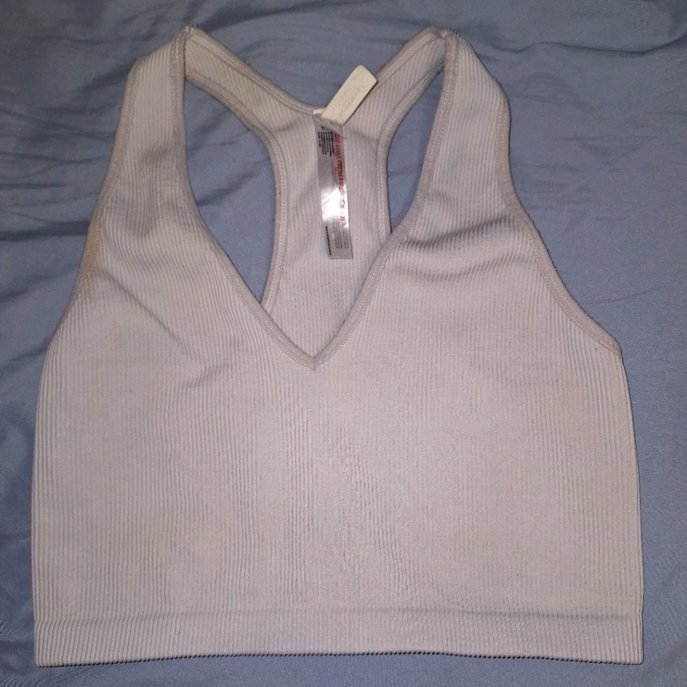 A Free People Movement sports bra in a size large. Pre-loved with a small spot.